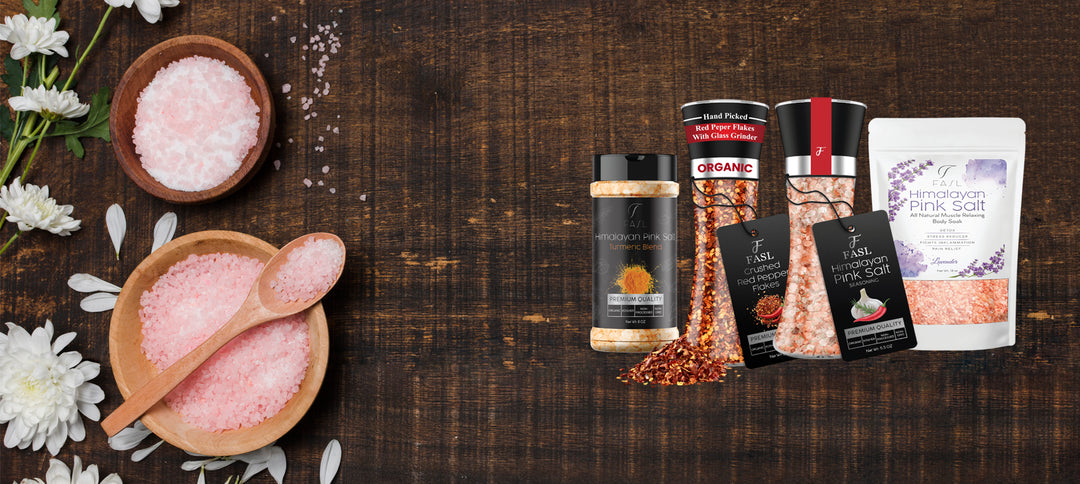 Himalayan pink salt in a wooden table along with other FASL himalayan pink salt products